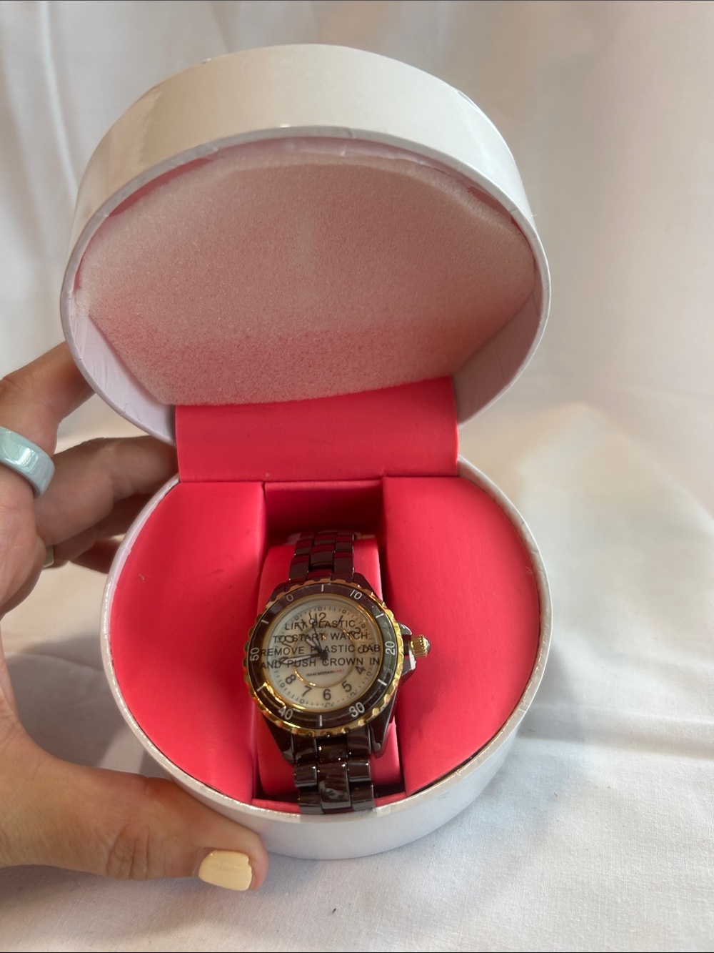 Gold-Tone Bezel Brown Bracelet Watch with Pink Display Cushion